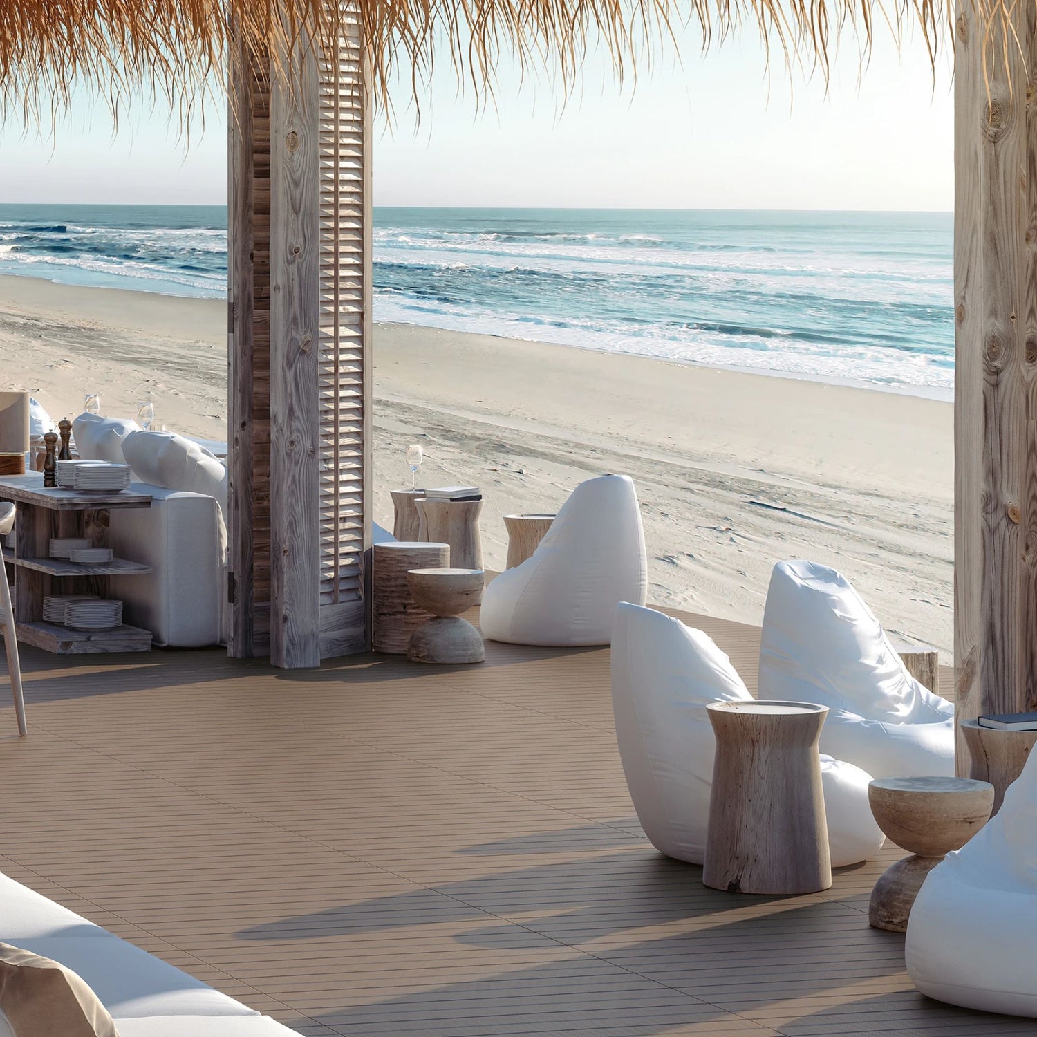 Pavimento cerâmico Dómino Topdeck Wengue 20x90cm aplicado no chão de uma esplanada moderna junto à praia   