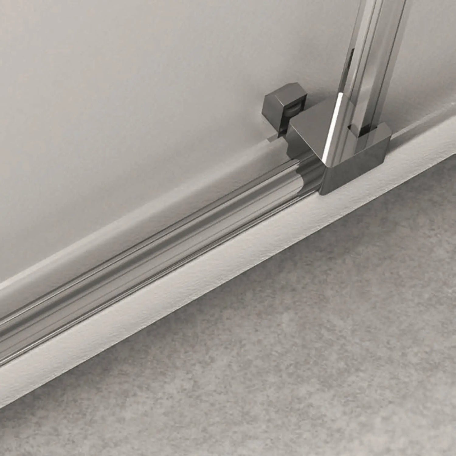 Detalhe do sistema de calhas e rolamentos inferiores da cabine de duche cromada.